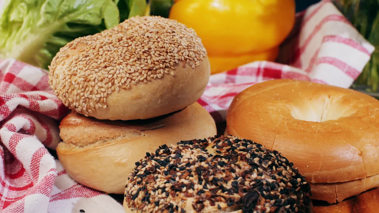 Bagel sandwich brunch, lunch plate of a bagel with smoked salmon and cream cheese and ham, close up morning cafe menu.