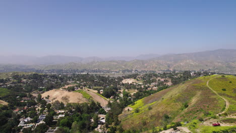 fly above hilly landscape