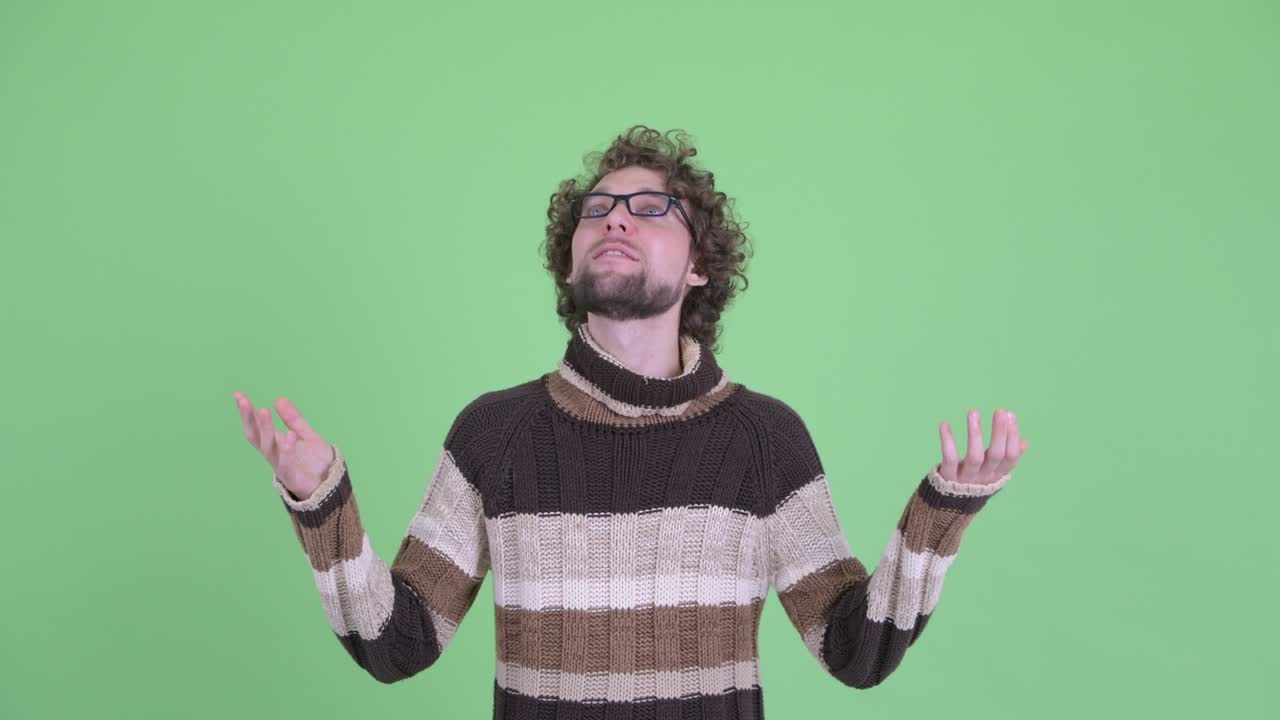 Young handsome bearded man with curly hair