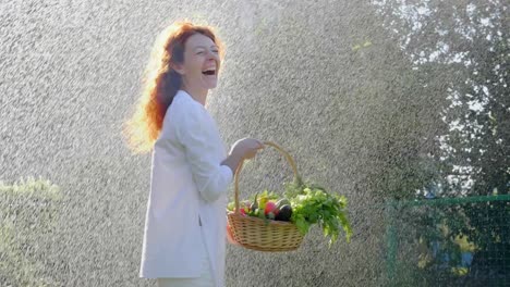 woman with a basket of fresh vegetables in a garden