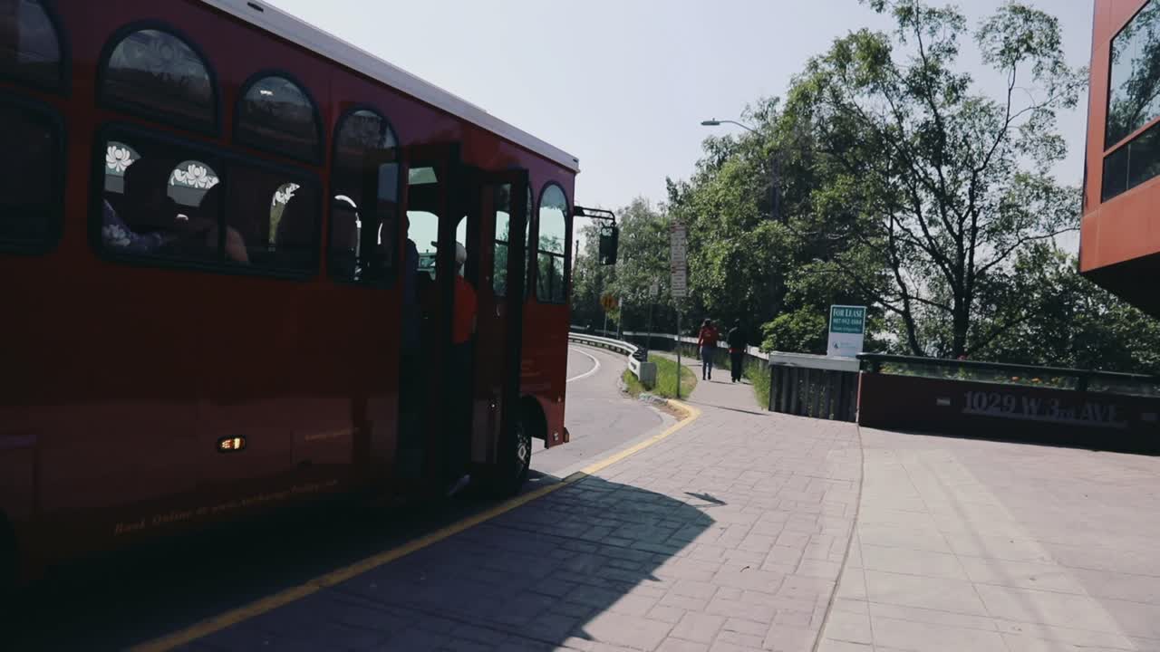 Tourist Passengers Boarding A Red Trolley Bus In Anchorage. Anchorage Trolley Tours In Alaska. timelapse