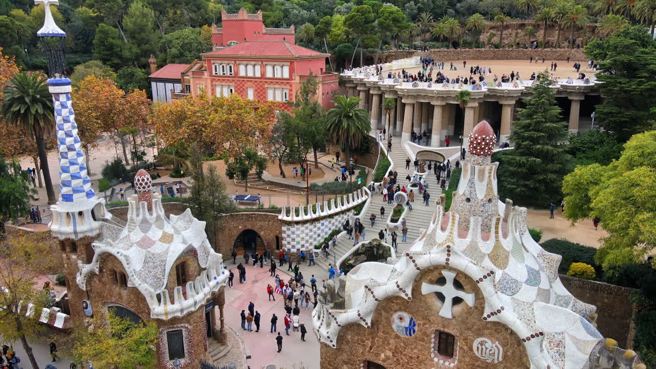 Aerial drone view of Barcelona, Spain. Park Guell with tourists, a lot of greenery