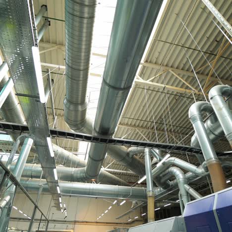 industrial factory ceiling with ventilation system and lights. ventilation ducts.