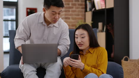 couple interacting with technology at home