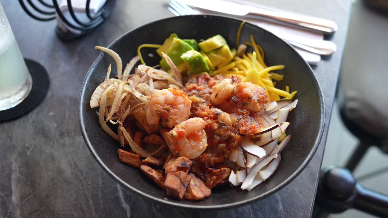 Seafood Bowl With Shrimp, Avocado, Onions and Coconut. Close up
