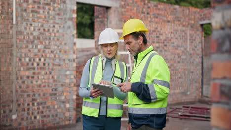 construction workers inspecting site
