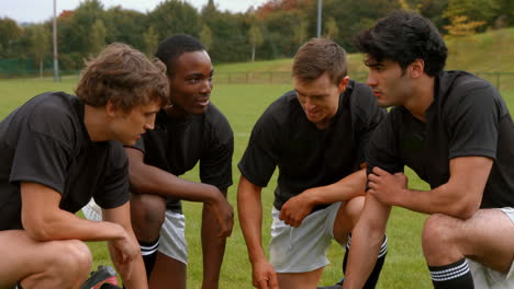 rugby team discussing tactics