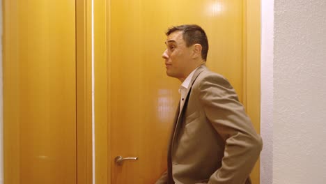 impatient businessman waiting for wife in bathroom