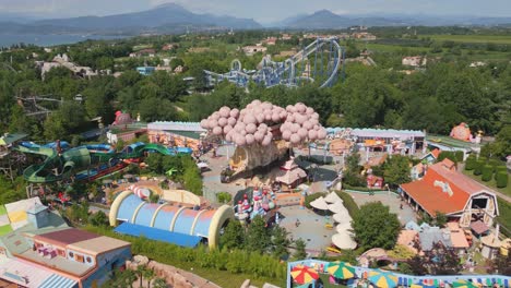 vibrant amusement water park entrance at gardaland, people excited to play and relax