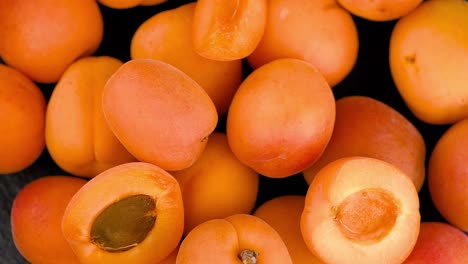 portion of apricots on a rotating plate (seamless loopable)