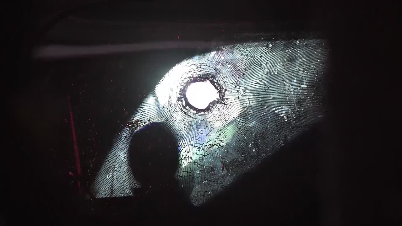 BULLET HOLE THROUGH WINDOW FLASH LIGHTS AND POLICE SIRENS IN BACKGROUND