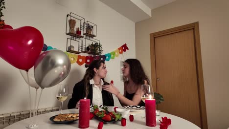 Lesbian couple celebrating a romantic dinner