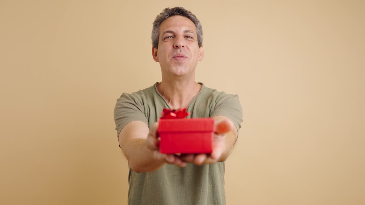 Man giving a red gift box