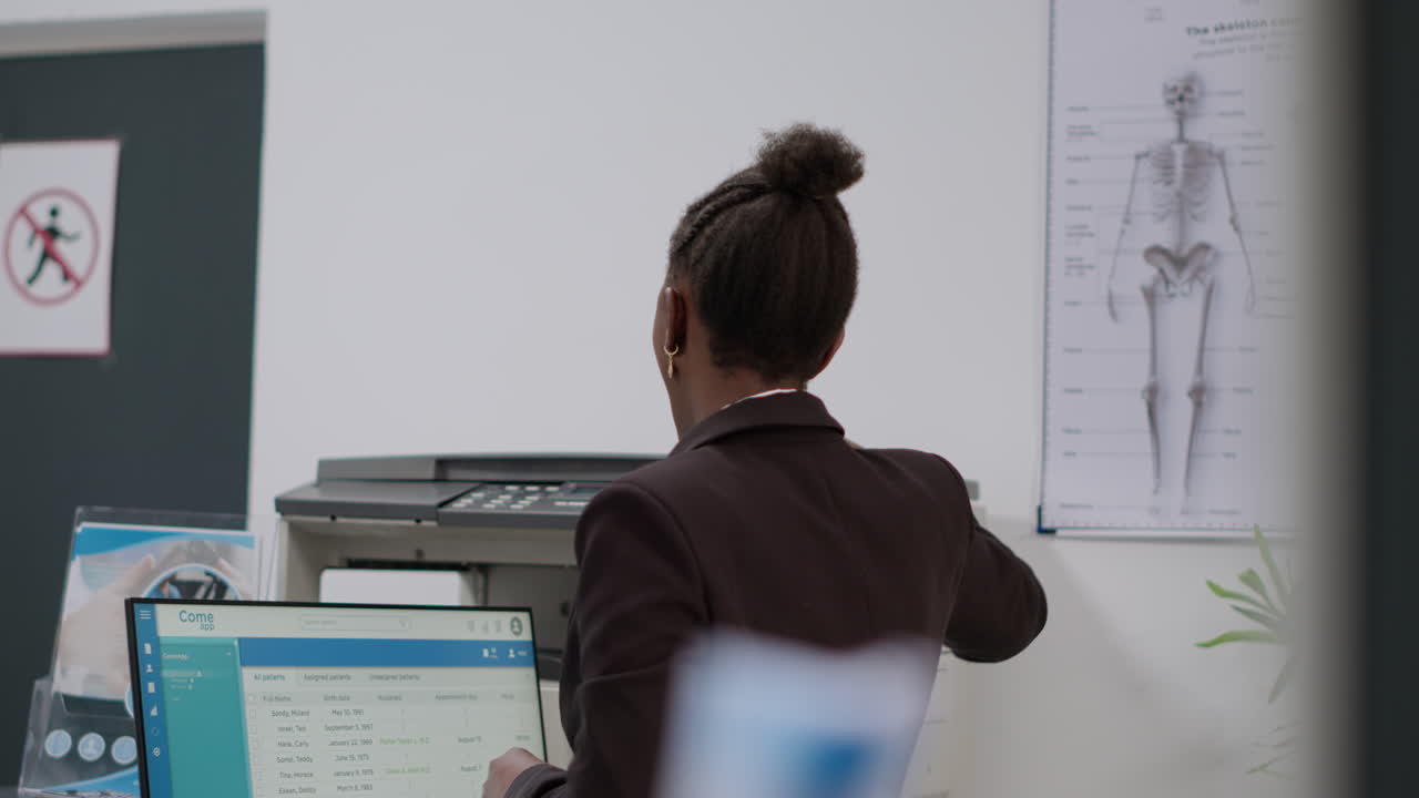 Woman Working at Medical Office Reception