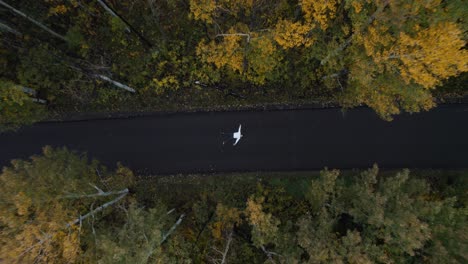 Drone-take-off-into-clouds-from-Alpine-loop-road-while-man-lay-on-the-ground