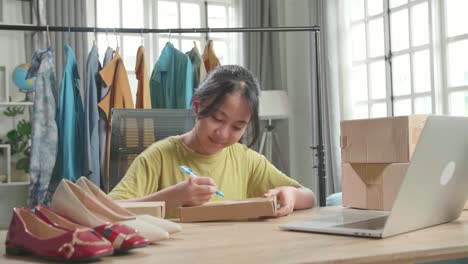 Young Entrepreneur Packaging Online Orders