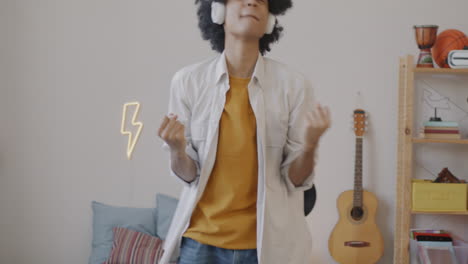 teenager dancing with headphones