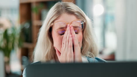 tired woman with eyes closed wearing eyeglasses