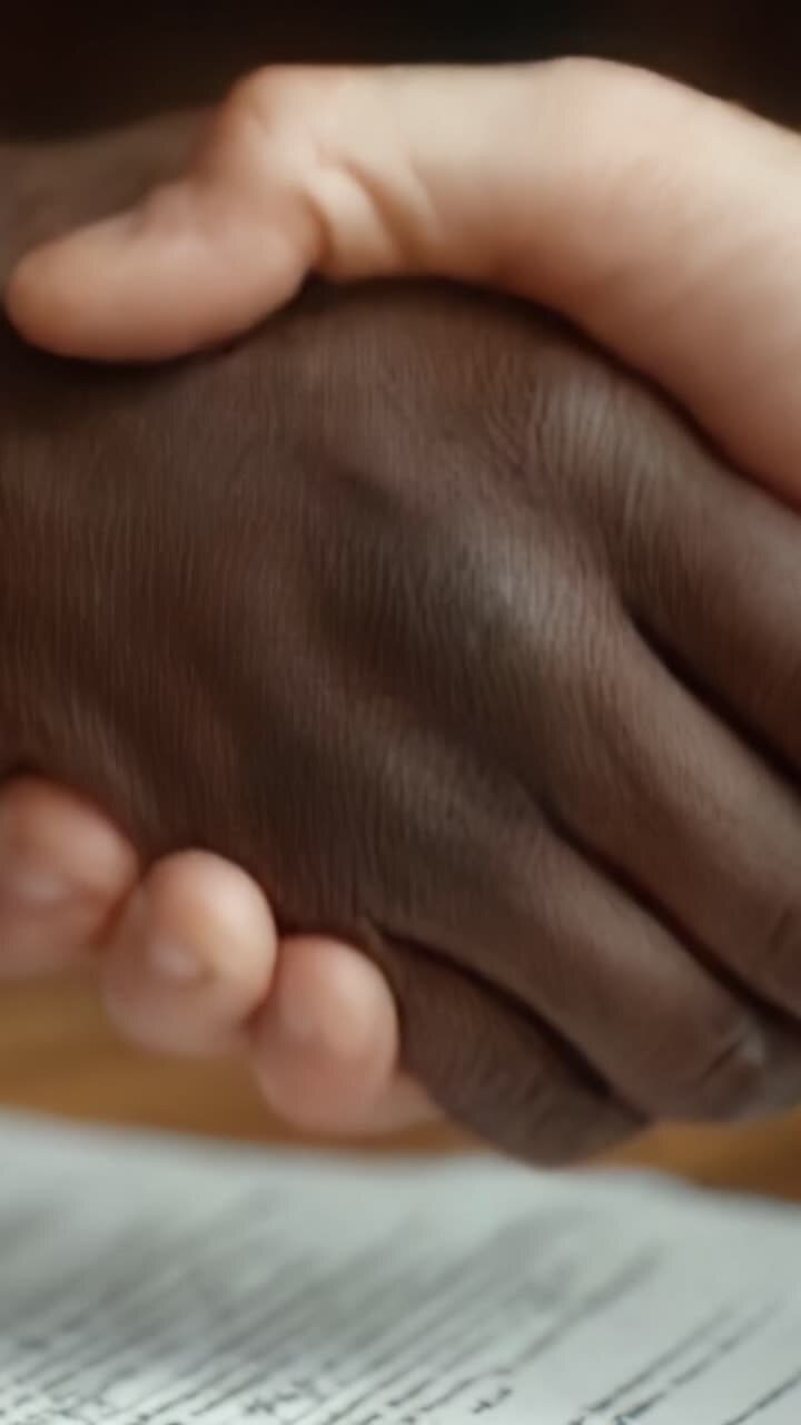 Symbolic Unity: A Close-Up of Diverse Hands Coming Together, Representing Collaboration and Understanding Across Cultures and Backgrounds