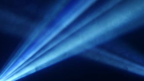 stage spotlight with laser blue rays and smoke