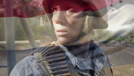 digital composition of waving netherlands flag against soldier standing at training camp