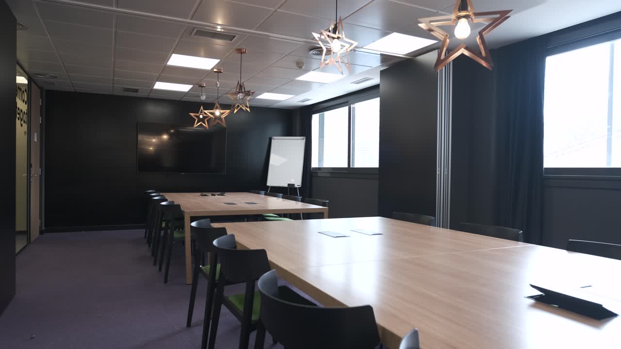 Interior of spacious office with tables and chairs