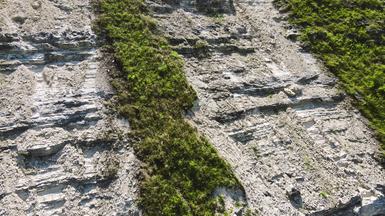 Aerial drone view of nature, Moldova. Rocky hill slope in a valley with greenery