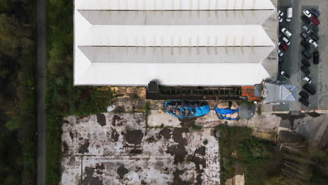 white rooftop of abandoned building in ghent, aerial top down view