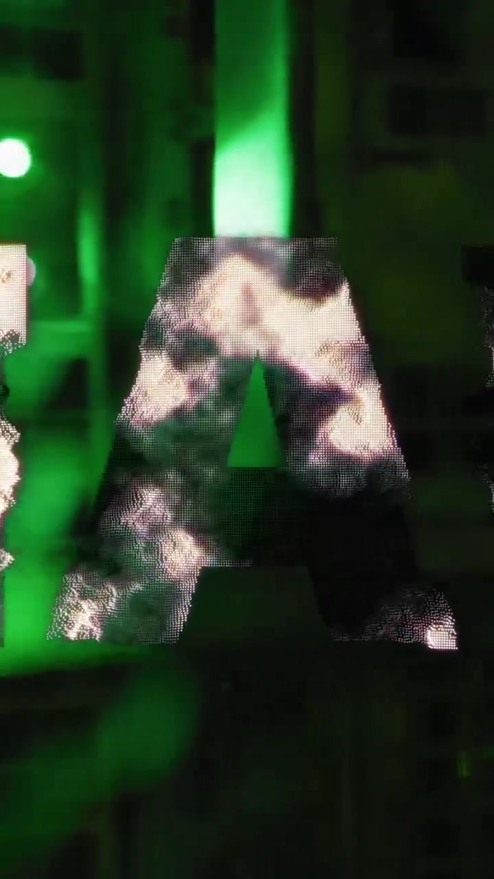 Uah symbol spinning against computer server room in background