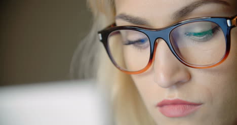 young businesswoman using laptop in office