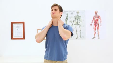 patient stretching his back in physiotherapy office