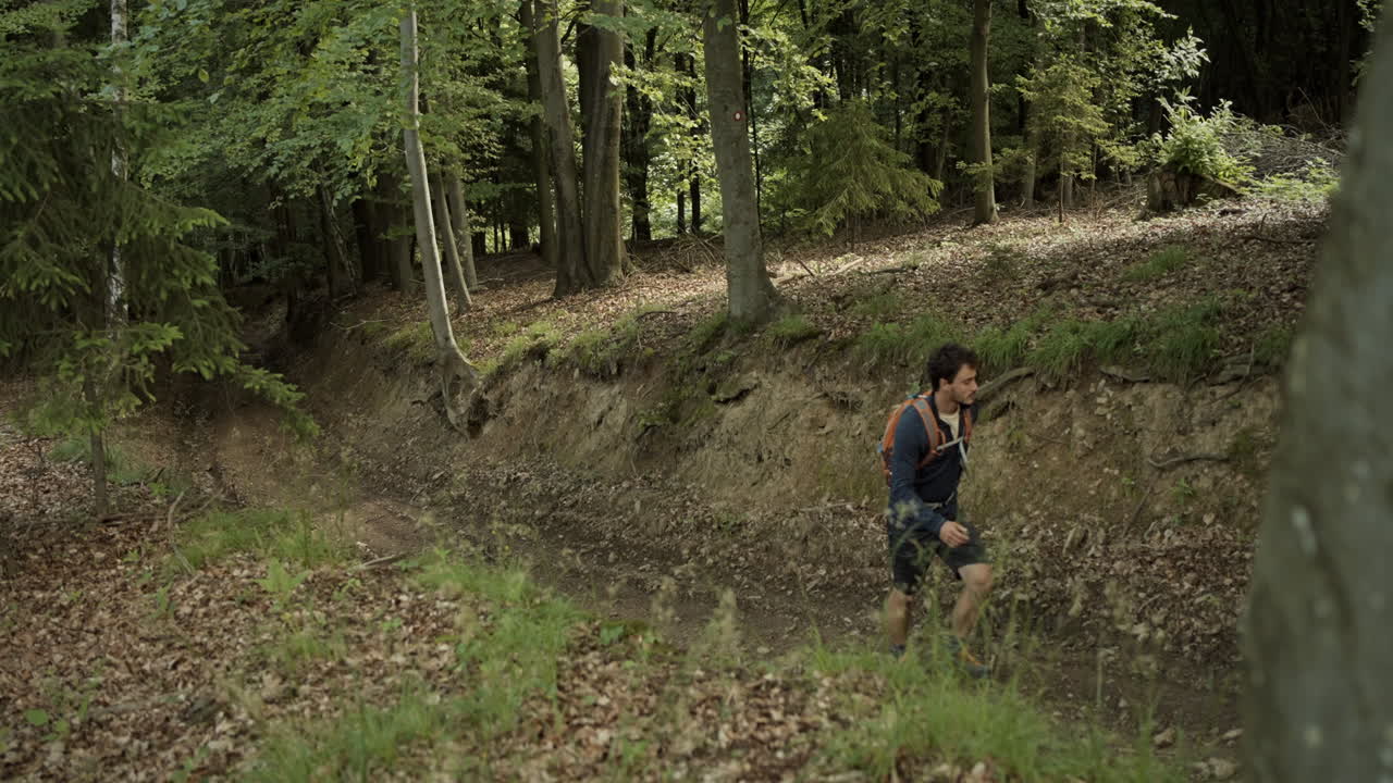 Wide top down shot of hiker man walking