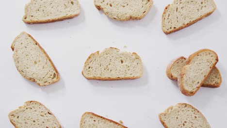 video of slices of bread seeing from above on white background