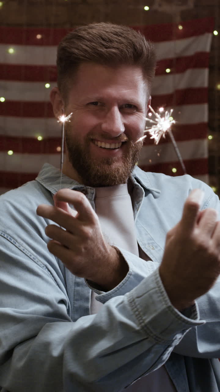 Man with Sparklers in Front of American Flag