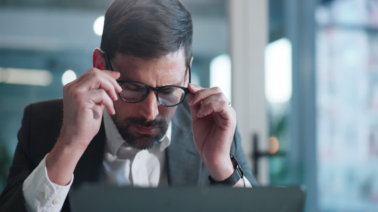 Close Up of Focused Businessman Working on Laptop in Office