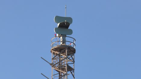Coastal-Surveillance-radar-on-mast,-looping