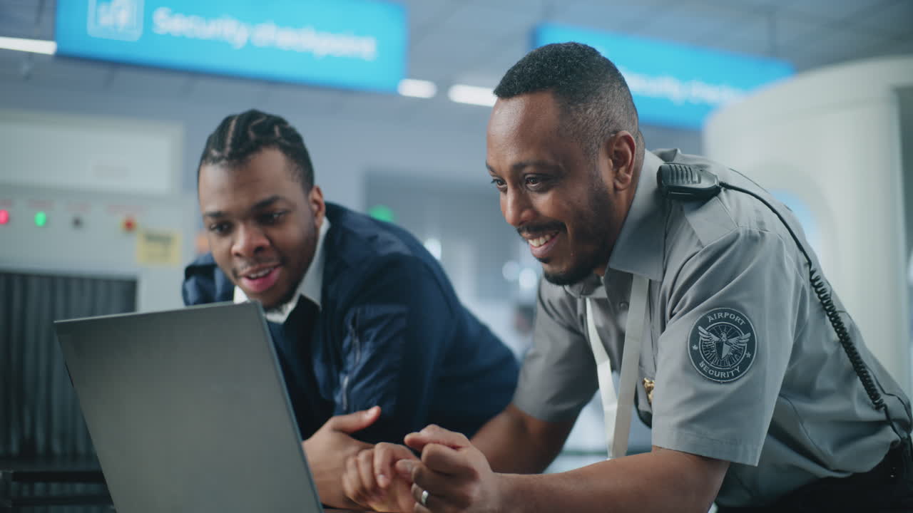 Airport Security Personnel Reviewing Data