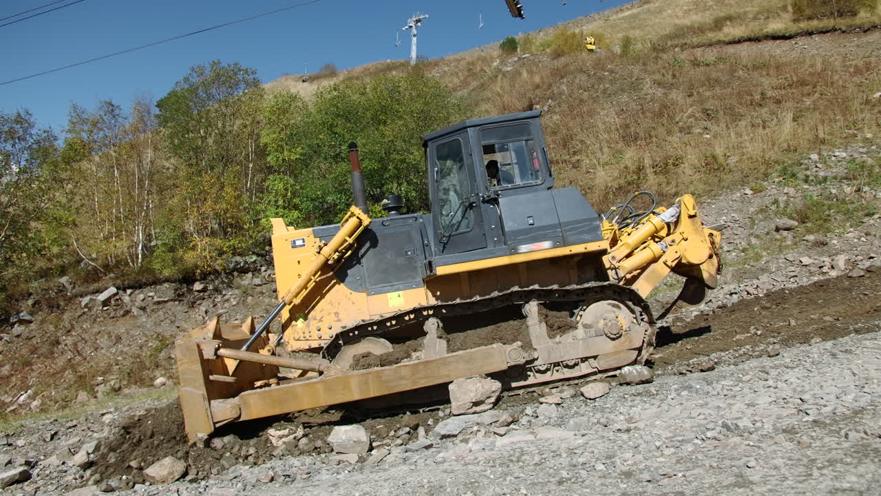 Bulldozer Working on a Mountain Road