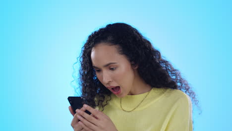 young woman, phone and celebration in studio