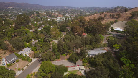 Rise-over-houses-and-streets-of-Eagle-Rock-neighborhood-in-Los-Angeles,-California-on-a-beautiful-day