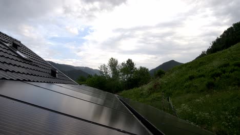 Timelapse-of-clouds-moving-above-solar-panels-installed-on-roof-of-private-home