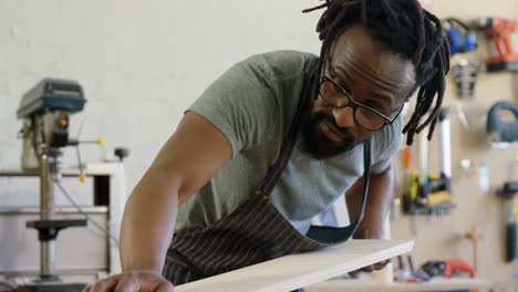 carpenter measuring wooden plank 4k