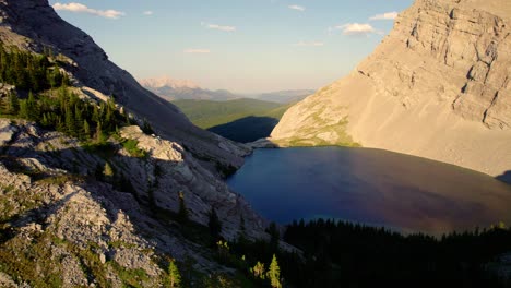 aerial pan sideways of alpine lake carnarvon lake, kananaskis, alberta, canada