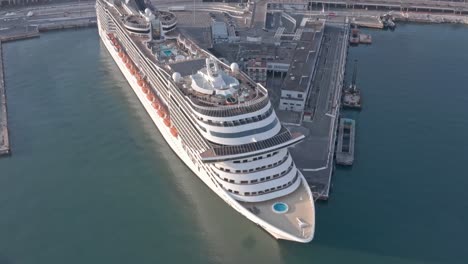 Massive-luxury-cruise-ship-docked-at-port-of-Genova,-Italy