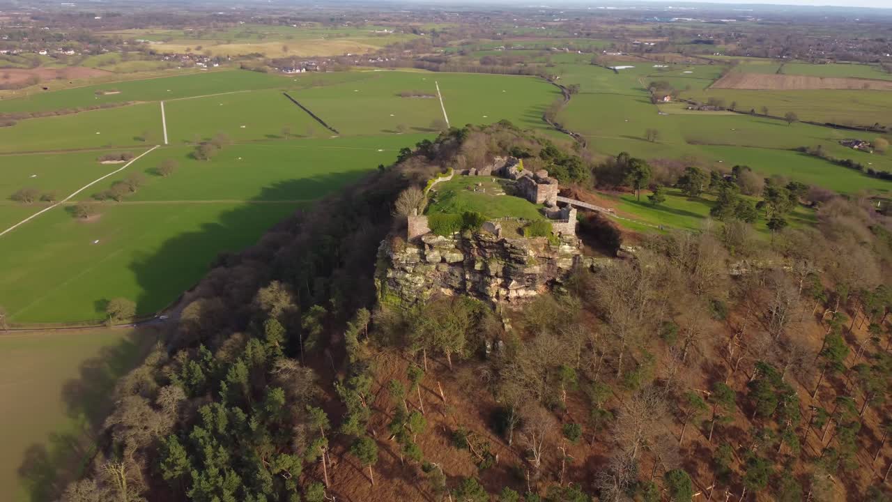 Drone circling iconic Beeston Castle ruins, originating in 1220 - Cheshire, UK