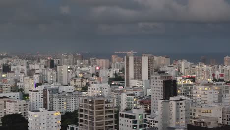 Drone-Shot-of-Modern-Residential-Neighborhood-of-Santo-Domingo,-Dominican-Republic,-Apartment-Buildings-Under-Cloudy-SKy