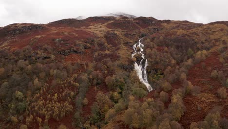 AERIAL---Ben-Glas-burn-waterfall,-Glencoe,-Scottish-Highlands,-Scotland,-rising