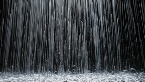 abstract video of cascading liquid strings, captured from a low angle