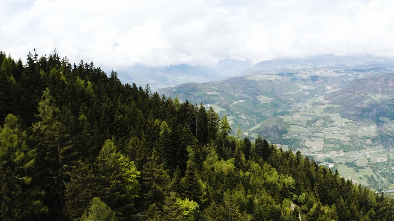 Aerial view overlooking Italy's roaming hillsides filled with trees