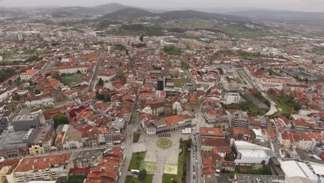 flying over from historic city center buildings in braga, portugal